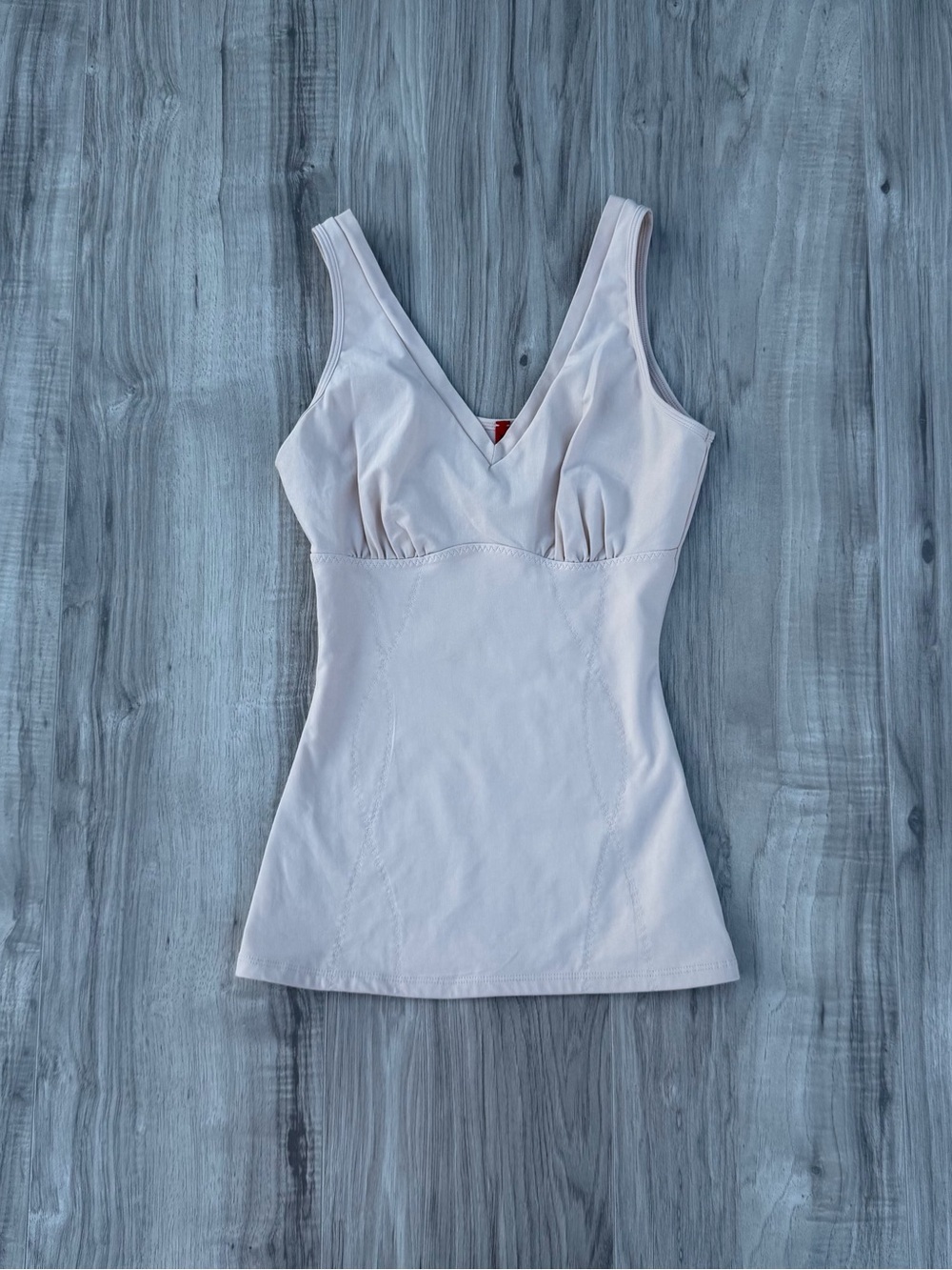 SPANX shapewear tank top features a gathered v-neckline